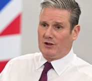 Keir Starmer speaks infront of a UK flag.
