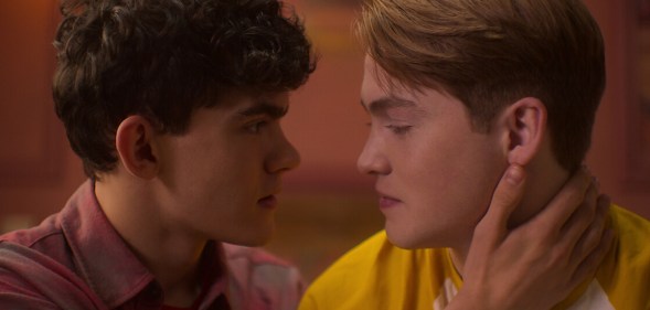 Joe Locke as Charlie and Kit Connor as Nick in Heartstopper on Netflix. Charlie and Nick about to kiss.