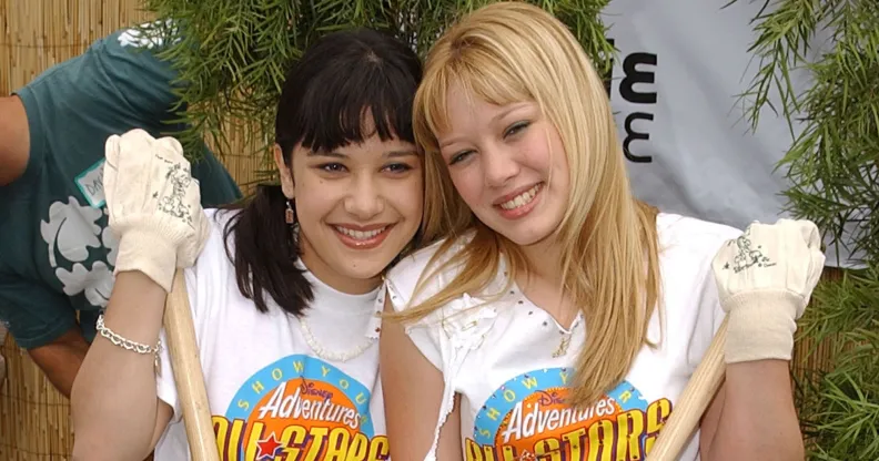 Actresses Lalaine (L) and Hilary Duff (R) of Dinsey's "Lizzie McGuire" volunteer to refurbish the grounds at the Boys and Girls Club of Burbank April 27, 2002 in Burbank, CA.