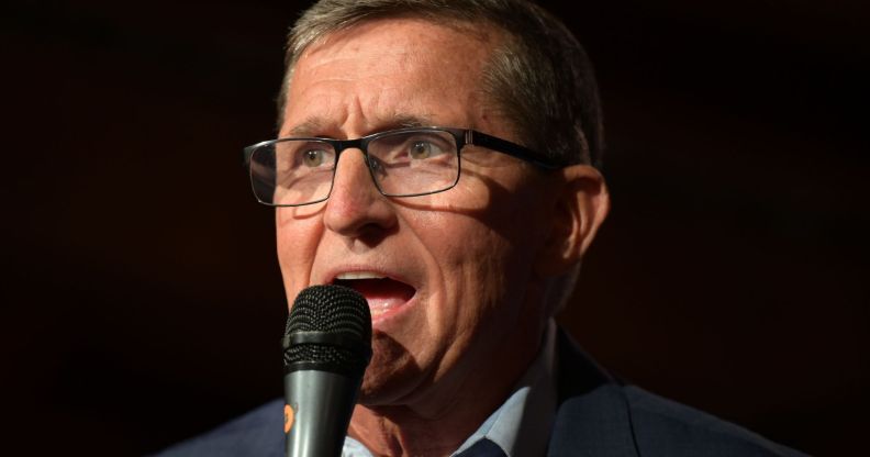 Michael Flynn, holding a microphone close to his face.