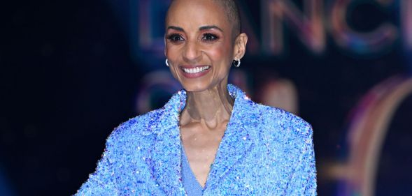 Adele Roberts staring ahead in a blue glittery suit