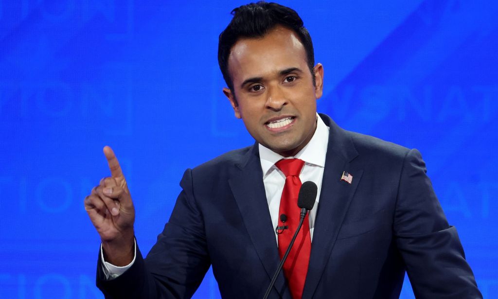 Vivek Ramaswamy, who has been suggested as a vice president pick for Donald Trump, wears a suit and tie as he gestures with one hand during a Republican presidential debate