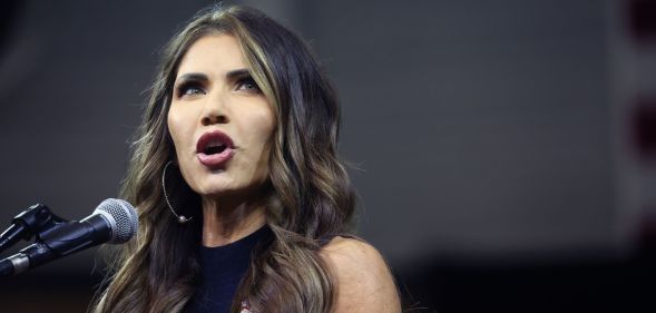 South Dakota governor Kristi Noem, who has been floated as a vice president candidate for Donald Trump, wears a black outfit as she speaks to people off camera