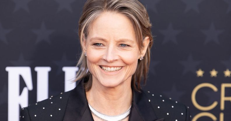 Actor Jodie Foster, who was once offered to play Princess Leia in Star Wars, smiles as she wears a black jacket with sparkly designs on it and a shiny silver necklace