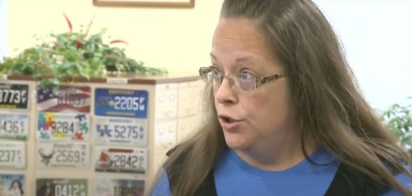 Kim Davis, a former county clerk who refused to issue marriage licenses to same-sex couples in Kentucky, wears a blue outfit as she talks to someone off camera