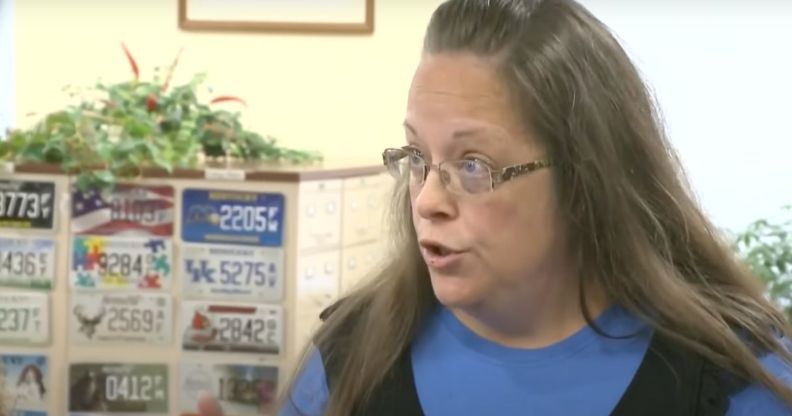 Kim Davis, a former county clerk who refused to issue marriage licenses to same-sex couples in Kentucky, wears a blue outfit as she talks to someone off camera