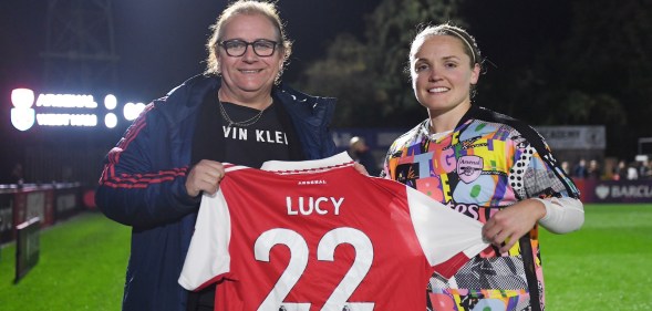 Lucy Clark is presented with a Rainbow Laces Arsenal home shirt by Kim Little, Captain of Arsenal prior to the Barclays FA Women's Super League match between Arsenal and West Ham United at Meadow Park on October 30, 2022 in Borehamwood, England. (Photo by Alex Burstow/Arsenal FC via Getty Images)