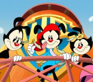 Cartoon image shows three animated characters called Yakko, Wakko and Dot, who are hanging over the balcony of a water tower emblazoned with the Warner Brothers logo.
