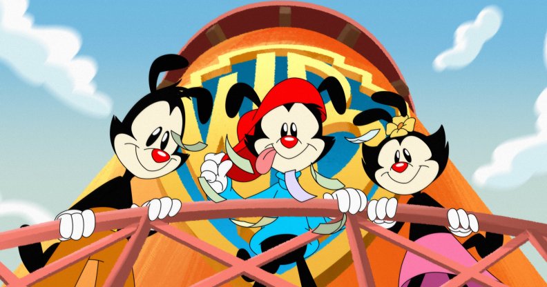 Cartoon image shows three animated characters called Yakko, Wakko and Dot, who are hanging over the balcony of a water tower emblazoned with the Warner Brothers logo.