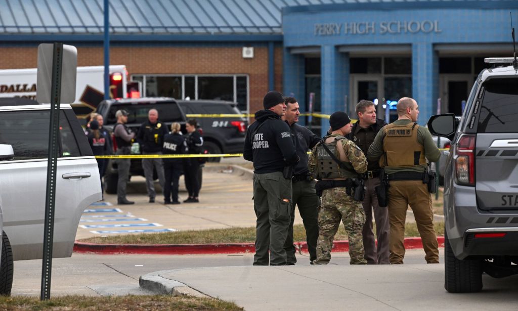 Law enforcement officers are seen outside Perry Middle School and High School complex after a mass shooting took place on 4 January 2024 in Perry, Iowa. Right-wing figures have latched onto and spread misinformation that the shooter was part of the LGBTQ+ community and/or identified as trans