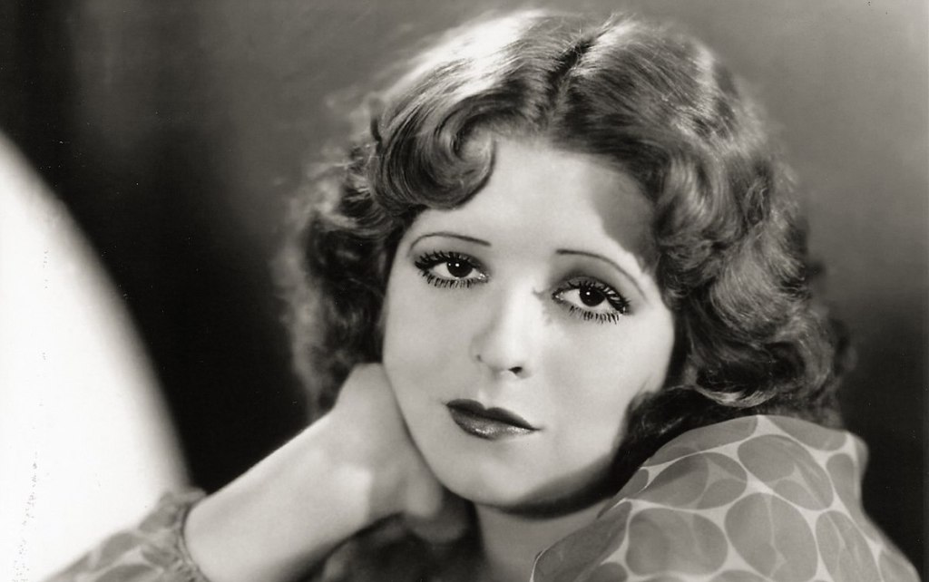 Clara Bow, in a black and white glamour close up shot