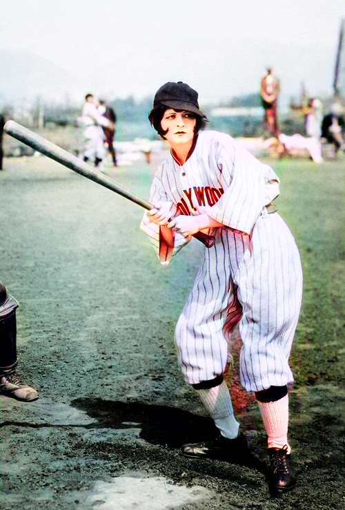 Clara Bow shown playing baseball in men's clothing in 1926