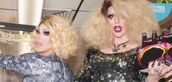 Two drag queens in a general store