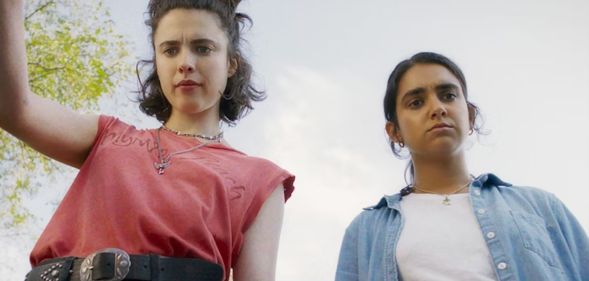 Margaret Qualley and Geraldine Viswanathan as Jamie and Marian in lesbian road trip comedy, Drive-Away Dolls. (Focus Features/Universal Pictures)