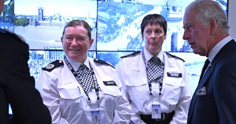 Photo shows two uniformed police officers meeting King Charles, the one on the left is Karen Findlay