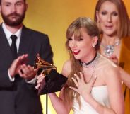 Taylor Swift onstage with Celine Dion at the 2024 Grammys. Swift is in the foreground and has her back to Celine Dion.