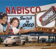 Image shows a vintage billboard with two children on it, the billboard says 'Nabisco: Switch to Oreo'