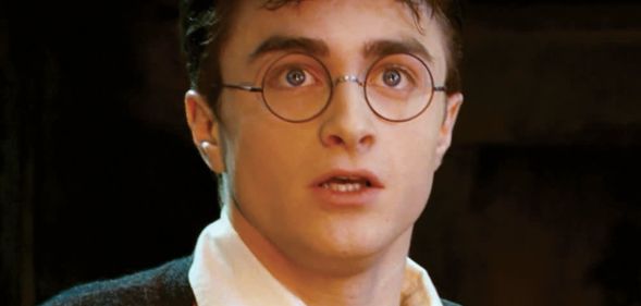 Daniel Radcliffe as Harry Potter looking shocked.