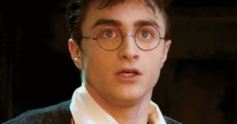 Daniel Radcliffe as Harry Potter looking shocked.