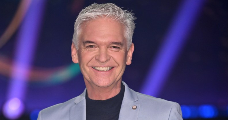 Philip Schofield smiling in a light blue suit.