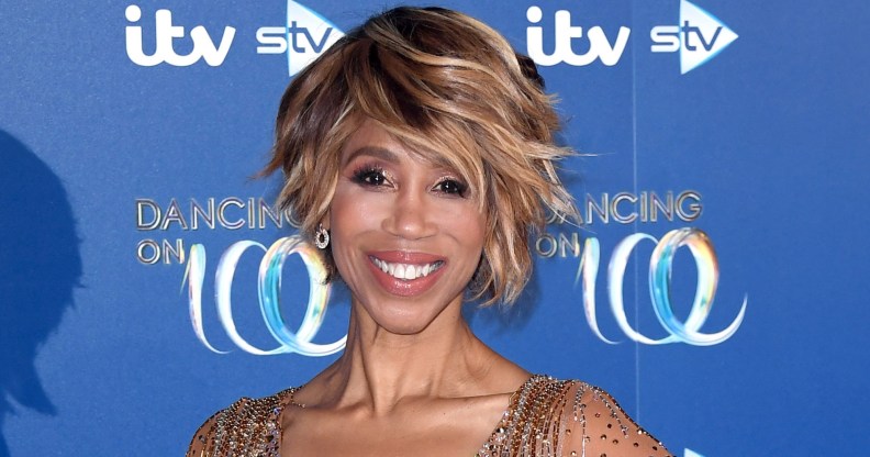 Trisha Goddard on the Dancing on Ice red carpet with a gem studded gown smiling at the camera.
