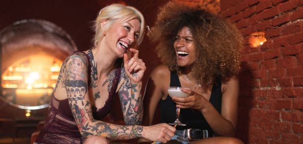 Stock image of two women in a bar to illustrate opening of London lesbian bar La Camionera