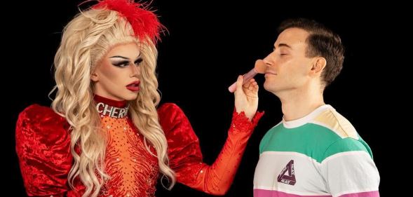 Drag queen Cherry West (left) preparing to give Scotland's first out gay pro male footballer Zander Murray a drag makeover