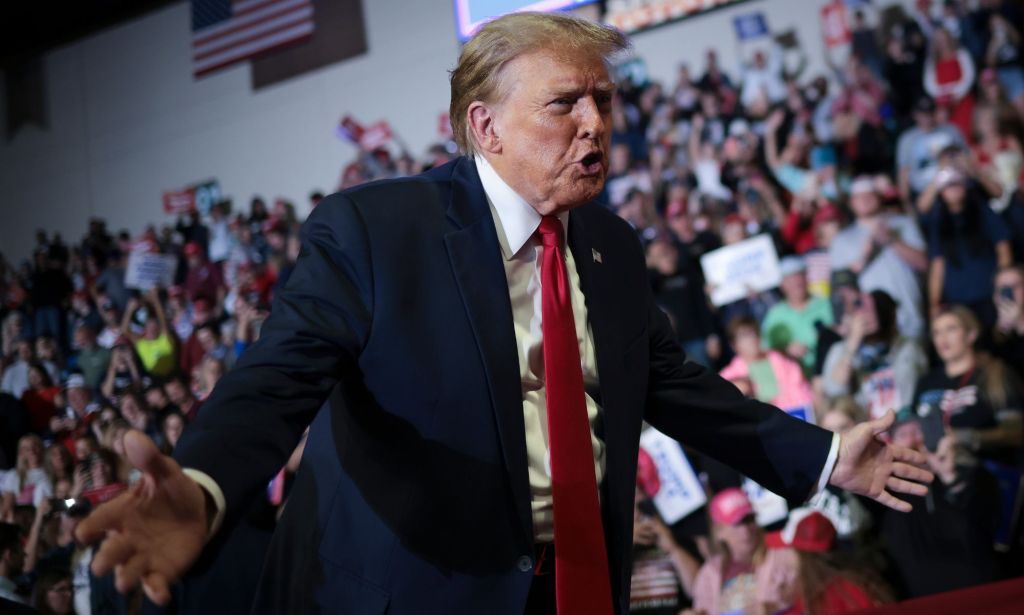 Donald Trump stands before supporters at a 2024 Republican presidential nominee campaign rally in South Carolina where he said he would abandon NATO allies who don't pay their bills and were under threat from Russia