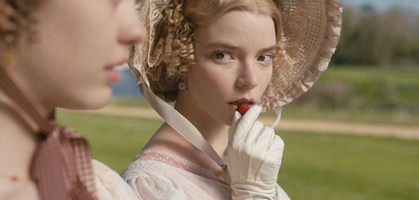 A scene from the 2020 Jane Austen film Emma, showing Emma - played by Anna Taylor-Joy – gazing at her friend Harriet (Mia Goth) while sitting on a bench outdoors