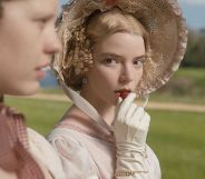 A scene from the 2020 Jane Austen film Emma, showing Emma - played by Anna Taylor-Joy – gazing at her friend Harriet (Mia Goth) while sitting on a bench outdoors