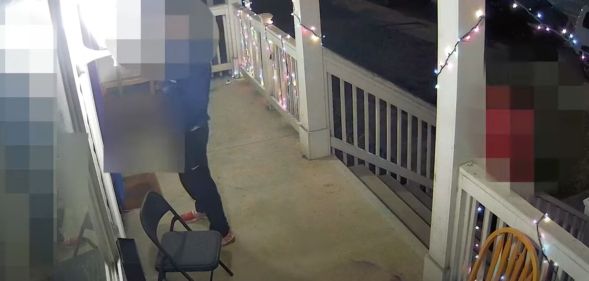 An Ohio man, who has been blurred out, is captured on surveillance video as he pees on an LGBTQ+ Pride flag outside a home
