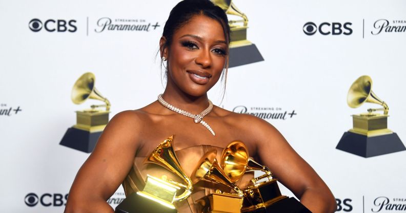 Bisexual Victoria Monét holding her three Grammy Awards at the 66th Annual Grammys