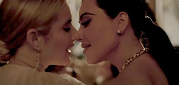 Kim Kardashian and Emma Roberts share a kiss in the American Horror Story Trailer. (YouTube/FX Networks)