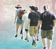 trans campers walking through a forest