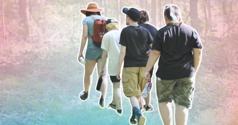 trans campers walking through a forest