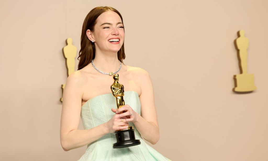 Emma Stone holds her Best Actress Oscar.