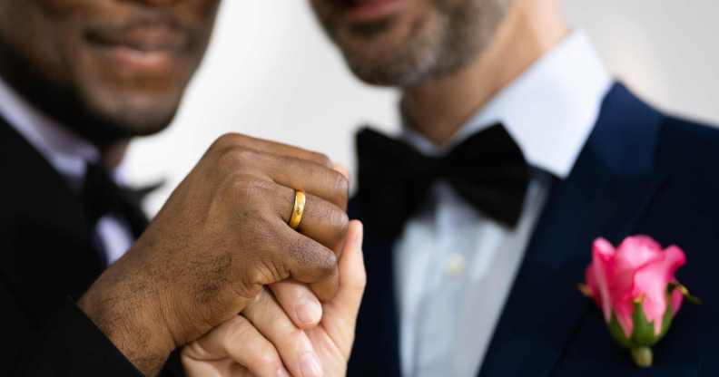 Equal marriage picture showing two grooms getting married