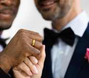Equal marriage picture showing two grooms getting married