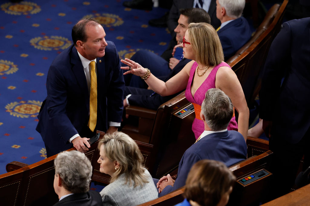 Sen. Mike Lee (R-UT) (L) talks with Sen. Kyrsten Sinema (I-AZ) before Israeli President Isaac Herzog addresses a joint meeting of the U.S. Congress at the U.S. Captiol on July 19, 2023 in Washington, DC. Herzog's speech on the floor of the House of Representatives stirred controversy as some liberal Democrats planned to boycott, underscoring tensions between the two countries. (Photo by Chip Somodevilla/Getty Images)