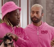 Two men in pink hoodies in the Hilton ad