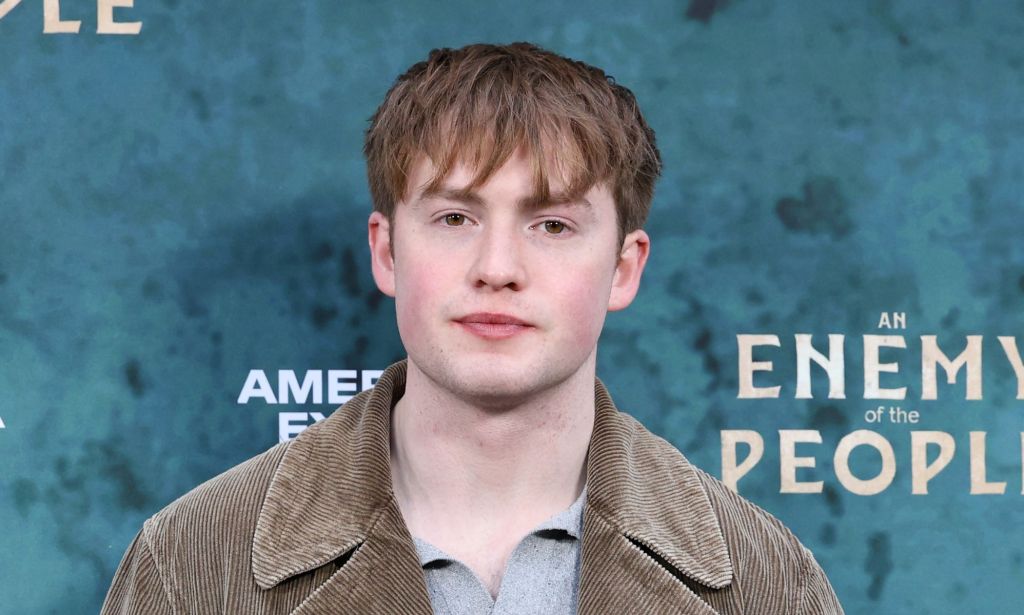 Kit Connor in a grey top and jacket