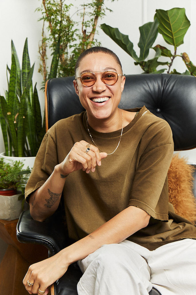 This is an image of Kylo Freeman. They are wearing a brown shirt and khaki pants
