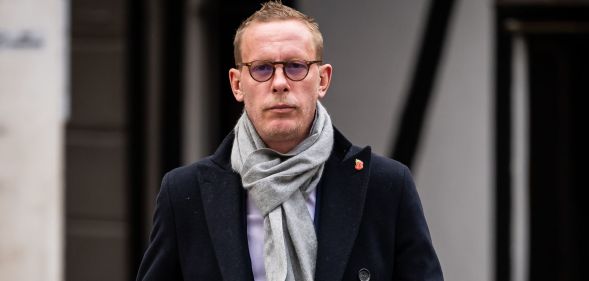 Former actor Laurence Fox stands outside the Royal Courts of Justice