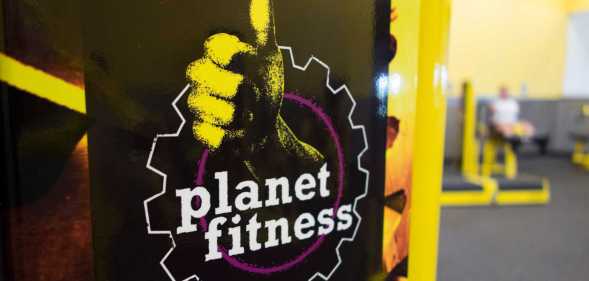 A woman leg lifts at Planet Fitness in the Columbia Mall on July 24, 2017 in Bloomsburg, Pennsylvania. - Mall space is being repurposed as more department store chains close stores that have traditionally served as "anchors" at malls. The Planet Fitness now occupies the space that was previously a Sears. Abandoned by the big brands, deserted by the young, the American mall, once temples of the shopping, have become ghost towns, victims of the explosion of online shopping. (Photo by Don EMMERT / AFP) / TO GO WITH AFP STORY by John BIERS, "Deserted, US shopping centers look for a future" (Photo by DON EMMERT/AFP via Getty Images)