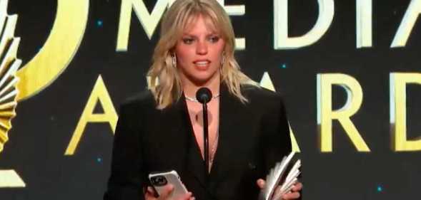 Reneé Rapp stands on stage during her acceptance speech at the GLAAD Media Awards in which she spoke out against the Israel–Hamas war.