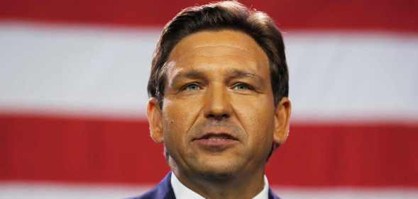 Florida governor Ron DeSantis in front of a US flag
