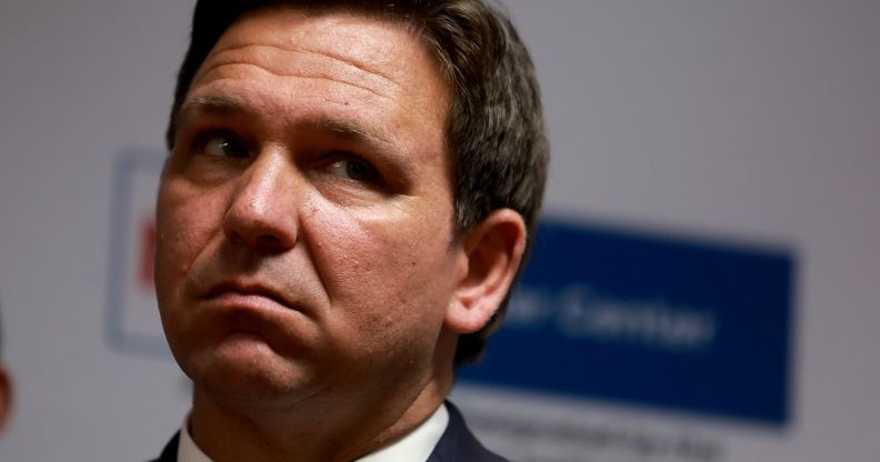 A headshot of Ron DeSantis looking upset during an event.