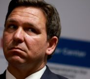 A headshot of Ron DeSantis looking upset during an event.