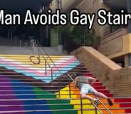 Video captioned 'Man Avoids Gay Stairs' shows man in shorts dragging himself up a metal handrail to avoid walking on stairs painted with the Progress Pride flag in Sydney.