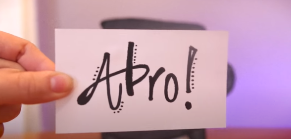 The phrase 'ABRO' written on a piece of paper